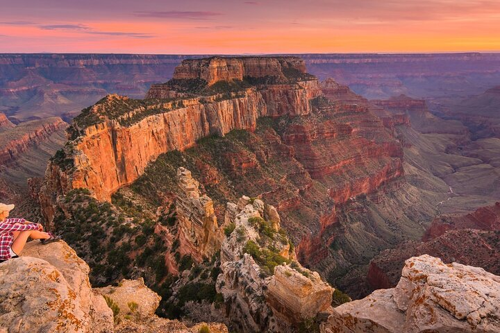 Experience breathtaking vistas at the Grand Canyon South Rim where the sun sets over stunning rock formations creating a majestic backdrop for unforgettable exploration and adventure.